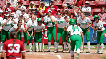 Oregon celebrates the home run of Tehya Bird (44) third inning of the NCAA Norman Regional tournament softball final between the Oklahoma Sooners and the Oregon Ducks at Love's Field in Norman, Okla. Sunday, May, 19, 2024.