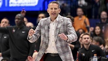 Mar 15, 2025; Nashville, TN, USA;  Alabama Crimson Tide head coach Nate Oats cheers after a made basket against the Florida Gators during the first half at Bridgestone Arena. Mandatory Credit: Steve Roberts-Imagn Images