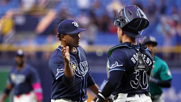 Jun 25, 2024; St. Petersburg, Florida, USA; Tampa Bay Rays pitcher Edwin Uceta (63) and catcher Ben Rortvedt (30) celebrate after they beat the Seattle Mariners during the ninth inning at Tropicana Field. Mandatory Credit: Kim Klement Neitzel-Imagn Images