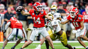 Jan 2, 2025; New Orleans, LA, USA;  Georgia Bulldogs quarterback Gunner Stockton (14) passes against Notre Dame Fighting Irish defensive lineman RJ Oben (9) during the second half at Caesars Superdome. Mandatory Credit: Stephen Lew-Imagn Images