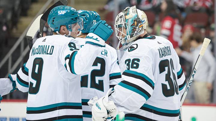 Dec 1, 2023; Newark, New Jersey, USA; San Jose Sharks goaltender Kaapo Kahkonen (36) celebrates with defenseman Jacob MacDonald (9) after defeating the New Jersey Devils at Prudential Center. Mandatory Credit: Vincent Carchietta-USA TODAY Sports