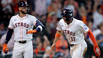 Aug 16, 2025; Houston, Texas, USA; Houston Astros right fielder Cam Smith (11) is greeted by third baseman Carlos Correa (1) after scoring a run against the Baltimore Orioles during the fourth inning at Daikin Park.