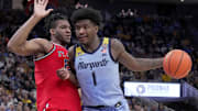 St. John’s forward Zuby Ejiofor (24) guards Marquette guard Kam Jones (1) during the first half of their game Saturday, March 8, 2025 at Fiserv Forum in Milwaukee, Wisconsin.
