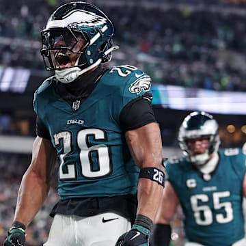 Jan 26, 2025; Philadelphia, PA, USA; Philadelphia Eagles running back Saquon Barkley (26) celebrates after a touchdown against the Washington Commanders during the second half in the NFC Championship game at Lincoln Financial Field. Mandatory Credit: Bill Streicher-Imagn Images