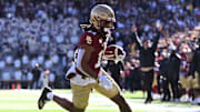 Nov 9, 2024; Chestnut Hill, Massachusetts, USA; Boston College Eagles wide receiver Lewis Bond (11) runs for a touchdown against the Syracuse Orange during the first half at Alumni Stadium. Mandatory Credit: Brian Fluharty-Imagn Images