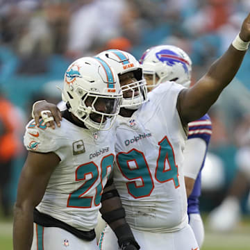 Miami Dolphins linebacker Jordyn Brooks (20) and defensive tackle Jordan Phillips (94) celebrate during the second half against the Buffalo Bills at Hard Rock Stadium. 