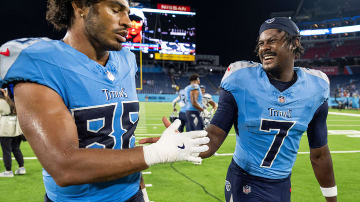 Tennessee Titans quarterback Malik Willis (7) celebrates with tight end David Martin-Robinson (88) after defeating the Seattle Seahawks at Nissan Stadium in Nashville, Tenn., Saturday, Aug. 17, 2024.