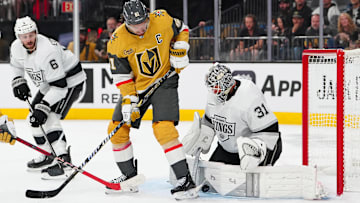 Oct 8, 2025; Las Vegas, Nevada, USA; Vegas Golden Knights right wing Mark Stone (61) deflects the puck against Los Angeles Kings goaltender Anton Forsberg (31) during the second period at T-Mobile Arena. Mandatory Credit: Stephen R. Sylvanie-Imagn Images