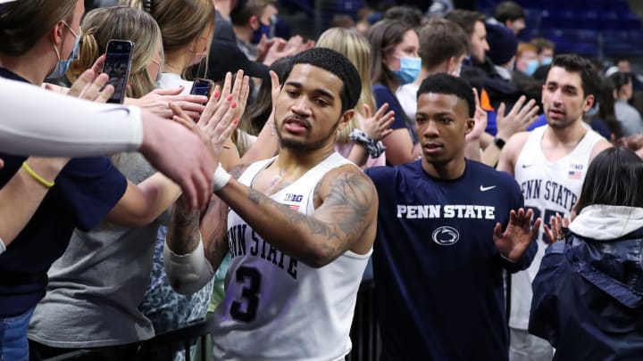 Penn State Nittany Lions guard Sam Sessoms shakes hands with the Penn State student section following the game against the Michigan State Spartans at Bryce Jordan Center.