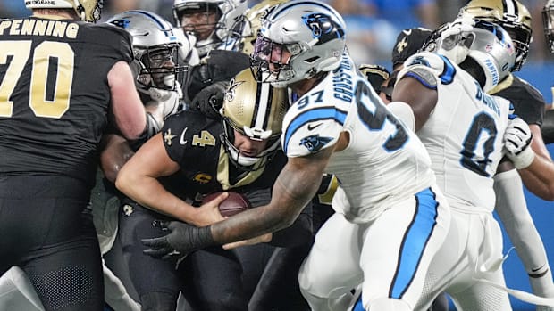 New Orleans Saints quarterback Derek Carr (4) is sacked against the Carolina Panthers  