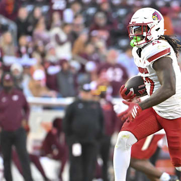 Nov 1, 2025; Blacksburg, Virginia, USA;  Louisville Cardinals running back Keyjuan Brown (22)  runs the ball for a touchdown against the Virginia Tech Hokies during the fourth quarter at Lane Stadium. Mandatory Credit: Brian Bishop-Imagn Images