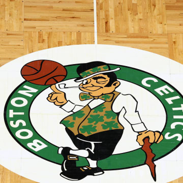 Apr 3, 2022; Boston, Massachusetts, USA; The Boston Celtics logo is seen on the parquet floor at center court before the game between the Boston Celtics and the Washington Wizards at TD Garden. Mandatory Credit: Winslow Townson-USA TODAY Sports