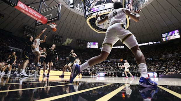 Purdue Boilermakers guard Myles Colvin (5) celebrates as Purdue Boilermakers forward Trey Kaufman-Renn (4) dunks the ball.