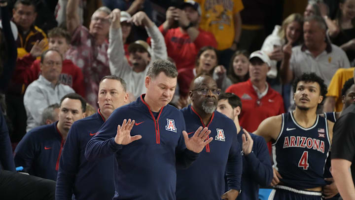 Feb 1, 2025; Tempe, Ariz., U.S.; Arizona Wildcats head coach Tommy Lloyd reacts after Arizona State Sun Devils head coach Bobby Hurley instructs his team to go to the locker room before the end of a Big 12 menÕs basketball game at Desert Financial Arena.