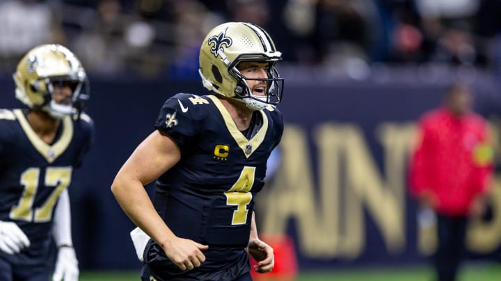 Jan 7, 2024; New Orleans, Louisiana, USA;  New Orleans Saints quarterback Derek Carr (4) celebrates a touchdown pass against the Atlanta Falcons during the second half at Caesars Superdome. Mandatory Credit: Stephen Lew-USA TODAY Sports