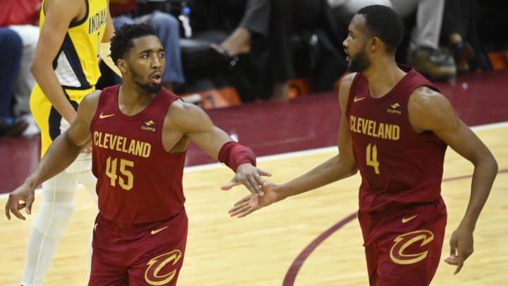 Apr 12, 2024; Cleveland, Ohio, USA; Cleveland Cavaliers guard Donovan Mitchell (45) and forward Evan Mobley (4) celebrate in the fourth quarter against the Indiana Pacers at Rocket Mortgage FieldHouse. Mandatory Credit: David Richard-USA TODAY Sports