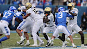 Nov 29, 2025; Provo, Utah, USA; UCF Knights running back Myles Montgomery (22) runs the ball against the BYU Cougars during the second half at LaVell Edwards Stadium. Mandatory Credit: Rob Gray-Imagn Images