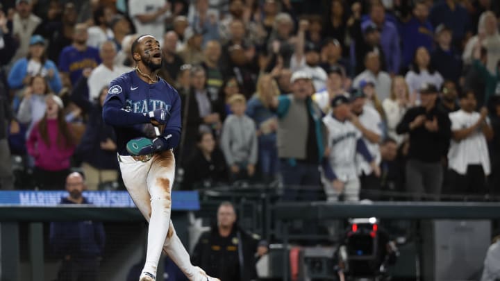 Seattle Mariners right fielder Victor Robles (10) reacts while scoring a run on a throwing error on an earlier stolen base attempt against the Tampa Bay Rays during the sixth inning at T-Mobile Park on Aug 27.