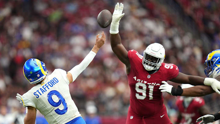 Arizona Cardinals defensive lineman L.J. Collier (91) attempts to block a pass by Los Angeles Rams quarterback Matthew Stafford (9) on Sept. 15, 2024, at State Farm Stadium in Glendale.