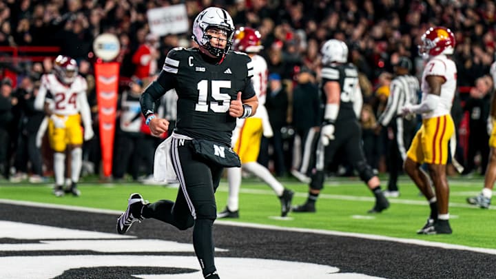 Nov 1, 2025; Lincoln, Nebraska, USA; Nebraska Cornhuskers quarterback Dylan Raiola (15) runs off after scoring a touchdown against the USC Trojans.