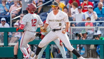 Jun 17, 2023; Omaha, NE, USA; Wake Forest Demon Deacons first baseman Nick Kurtz (8) makes a catch to retire Stanford Cardinal third baseman Tommy Troy (12) to end the game at Charles Schwab Field Omaha. Mandatory Credit: Dylan Widger-USA TODAY Sports