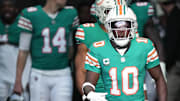 Miami Dolphins wide receiver Tyreek Hill (10) heads out to warm-up before the NFL game against the Dallas Cowboys at Hard Rock Stadium in Miami Gardens, Dec. 24, 2023.