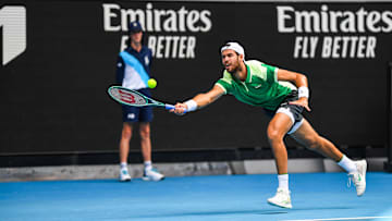 Karen Khachanov of Russia plays against Jannik Sinner of...