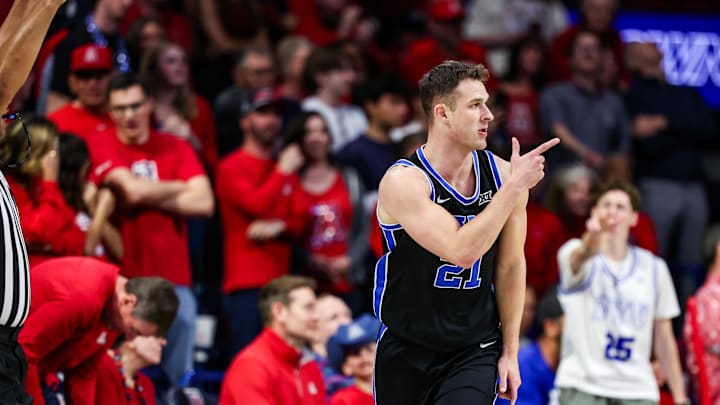Feb 22, 2025; Tucson, Arizona, USA; BYU Cougars guard Trevin Knell (21) points after he makes a three-point basket during the second half against the Arizona Wildcats at McKale Center. Mandatory Credit: Aryanna Frank-Imagn Images