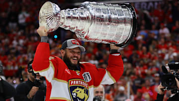 Jun 24, 2024; Sunrise, Florida, USA; Florida Panthers forward Kyle Okposo (8) hoists the Stanley Cup after defeating the Edmonton Oilers in game seven of the 2024 Stanley Cup Final at Amerant Bank Arena. Mandatory Credit: Sam Navarro-Imagn Images