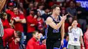 Feb 22, 2025; Tucson, Arizona, USA; BYU Cougars guard Trevin Knell (21) points after he makes a three-point basket during the second half against the Arizona Wildcats at McKale Center. Mandatory Credit: Aryanna Frank-Imagn Images