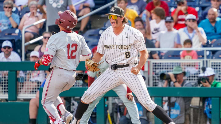 Jun 17, 2023; Omaha, NE, USA; Wake Forest Demon Deacons first baseman Nick Kurtz (8) makes a catch to retire Stanford Cardinal third baseman Tommy Troy (12) to end the game at Charles Schwab Field Omaha. Mandatory Credit: Dylan Widger-USA TODAY Sports