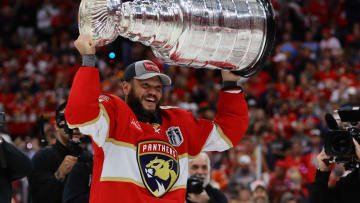 Jun 24, 2024; Sunrise, Florida, USA; Florida Panthers forward Kyle Okposo (8) hoists the Stanley Cup after defeating the Edmonton Oilers in game seven of the 2024 Stanley Cup Final at Amerant Bank Arena. Mandatory Credit: Sam Navarro-USA TODAY Sports