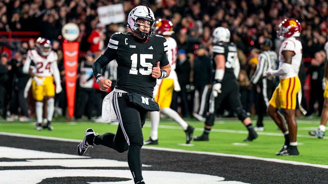 Nov 1, 2025; Lincoln, Nebraska, USA; Nebraska Cornhuskers quarterback Dylan Raiola (15) runs off after scoring a touchdown against the Southern California Trojans during the first quarter at Memorial Stadium. Mandatory Credit: Dylan Widger-Imagn Images
