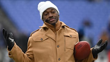 Jan 20, 2024; Baltimore, MD, USA; ESPN college football and NFL analyst Robert Griffin III reacts on the sidelines before a 2024 AFC divisional round game between the Houston Texans and the Baltimore Ravens at M&T Bank Stadium. Mandatory Credit: Tommy Gilligan-Imagn Images
