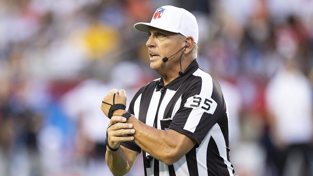 Aug 1, 2024; Canton, Ohio, USA; NFL 
referee John Hussey (35) makes a call for holding during the first quarter between the Chicago Bears and the Houston Texans at Tom Benson Hall of Fame Stadium. Mandatory Credit: Scott Galvin-Imagn Images