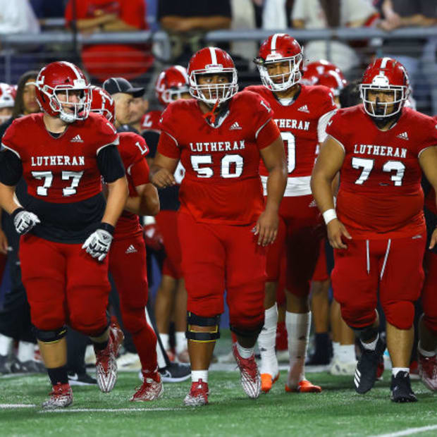 Orange Lutheran offensive linemen take the field against Sierra Canyon in 2023.