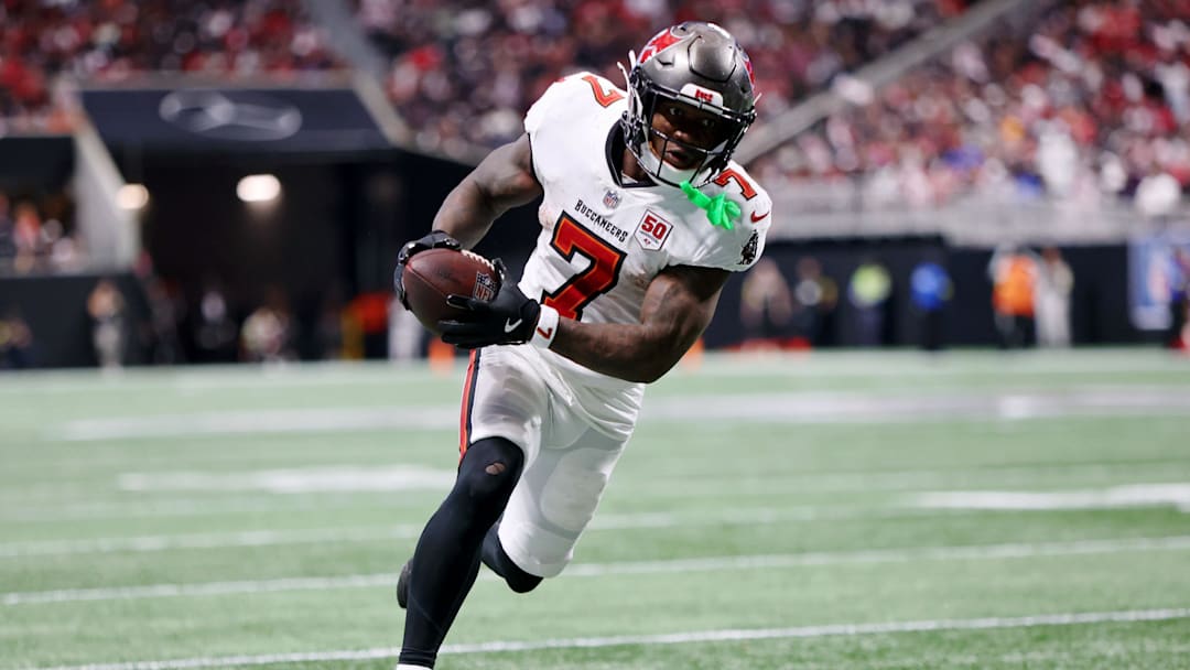 Sep 7, 2025; Atlanta, Georgia, USA; Tampa Bay Buccaneers running back Bucky Irving (7) runs with the ball for a touchdown against the Atlanta Falcons during the third quarter at Mercedes-Benz Stadium.