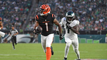 Aug 7, 2025; Philadelphia, Pennsylvania, USA; Cincinnati Bengals wide receiver Ja'Marr Chase (1) runs past Philadelphia Eagles cornerback Kelee Ringo (7) on a 36-yard touchdown catch during the first quarter against the Philadelphia Eagles at Lincoln Financial Field. Mandatory Credit: Eric Hartline-Imagn Images