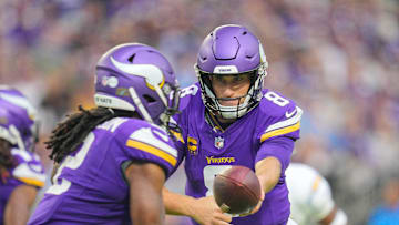 Sep 24, 2023; Minneapolis, Minnesota, USA; Minnesota Vikings quarterback Kirk Cousins (8) hands the