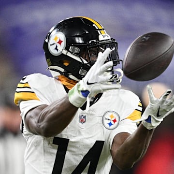 Jan 11, 2025; Baltimore, Maryland, USA; Pittsburgh Steelers wide receiver George Pickens (14) makes a catch against the Baltimore Ravens in the third quarter in an AFC wild card game at M&T Bank Stadium. Mandatory Credit: Tommy Gilligan-Imagn Images