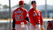 Alex Bregman of the Boston Red Sox has laugh with bench coach Ramón Vázquez during drills at JetBlue Park at Fenway South on Monday, Feb. 17, 2025.