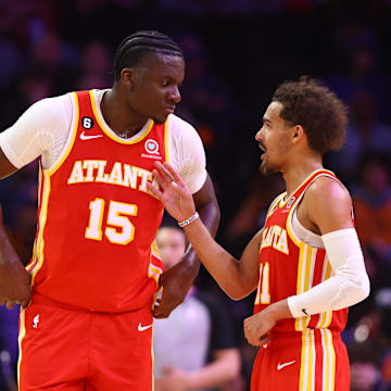 Feb 1, 2023; Phoenix, Arizona, USA; Atlanta Hawks center Clint Capela (15) with guard Trae Young (11) against the Phoenix Suns at Footprint Center. Mandatory Credit: Mark J. Rebilas-Imagn Images