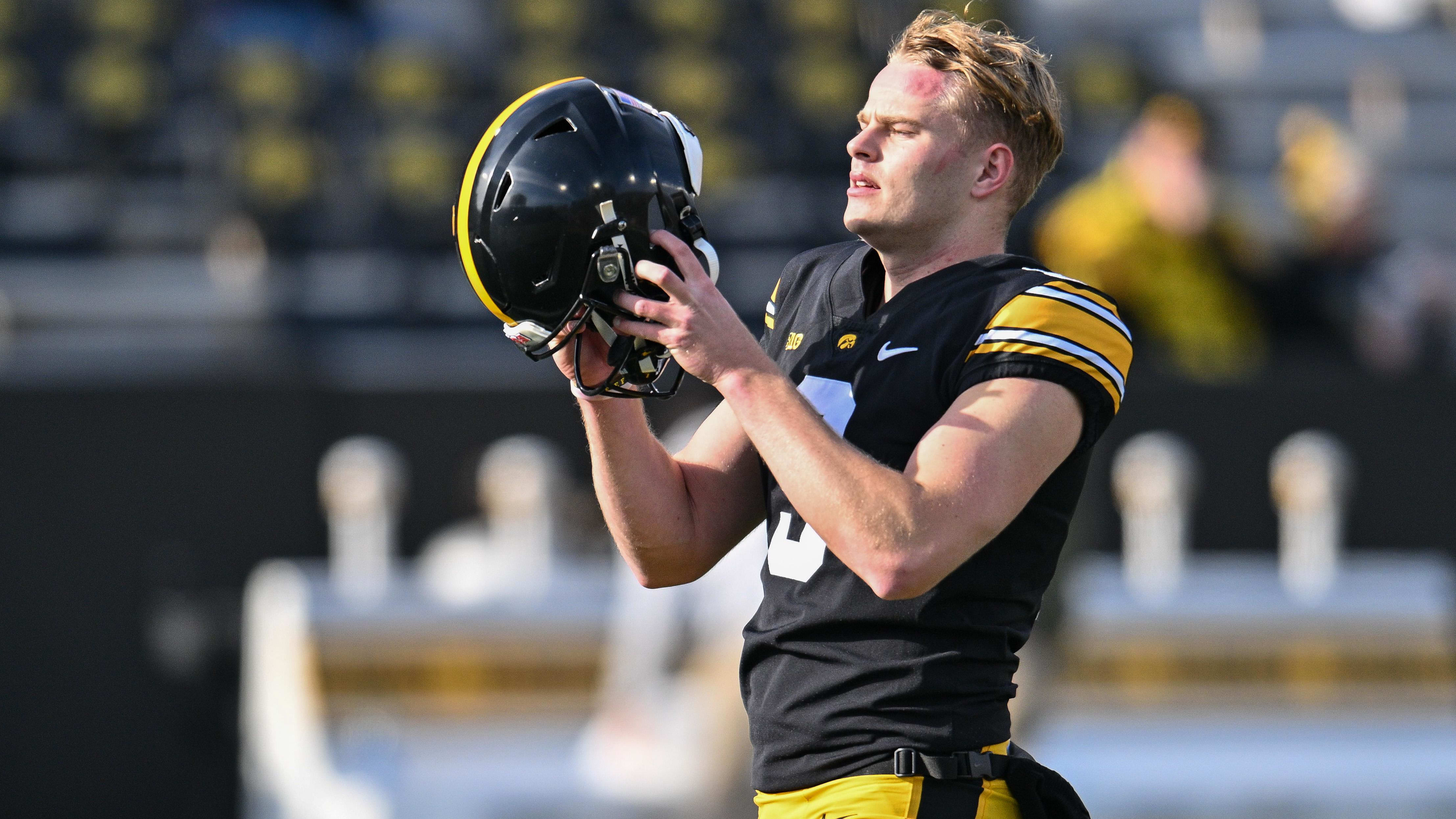 Iowa Hawkeyes punter Tory Taylor (9) looks on before the game.