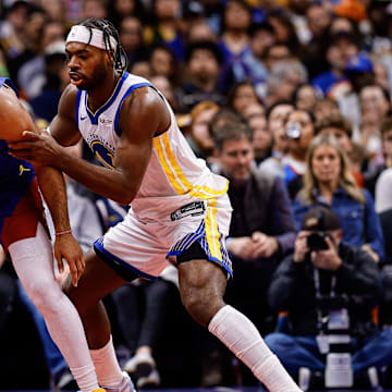 Nov 7, 2025; Denver, Colorado, USA; Denver Nuggets guard Jamal Murray (27) controls the ball under pressure from Golden State Warriors guard Buddy Hield (7) in the second quarter at Ball Arena. Mandatory Credit: Isaiah J. Downing-Imagn Images