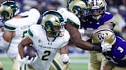 Aug 30, 2025; Seattle, Washington, USA; Colorado State Rams running back Jalen Dupree (2) rushes against the Washington Huskies during the first quarter at Husky Stadium. Mandatory Credit: Joe Nicholson-Imagn Images