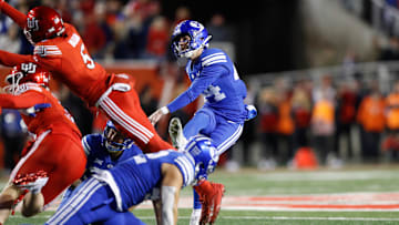 BYU's Will Ferrin kicks the football against Utah