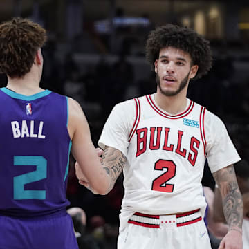 Nov 29, 2021; Chicago, Illinois, USA; Charlotte Hornets guard LaMelo Ball (2) and Chicago Bulls guard Lonzo Ball (2) hug after the game at United Center. Mandatory Credit: David Banks-Imagn Images