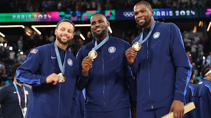 Stephen Curry, LeBron James, Kevin Durant pose with their gold medals at the 2024 Paris Olympics