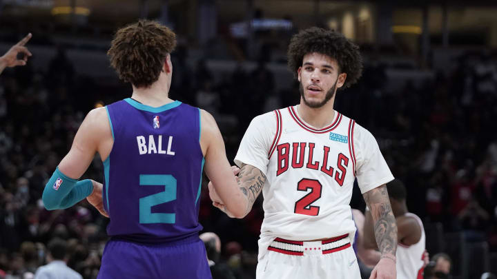 Nov 29, 2021; Chicago, Illinois, USA; Charlotte Hornets guard LaMelo Ball (2) and Chicago Bulls guard Lonzo Ball (2) hug after the game at United Center. Mandatory Credit: David Banks-Imagn Images