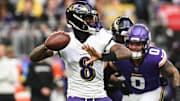 Nov 9, 2025; Minneapolis, Minnesota, USA; Baltimore Ravens quarterback Lamar Jackson (8) throws a pass against the Minnesota Vikings during the first quarter at U.S. Bank Stadium. Mandatory Credit: Jeffrey Becker-Imagn Images